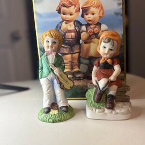 Set of Hummel figurines and vintage tin